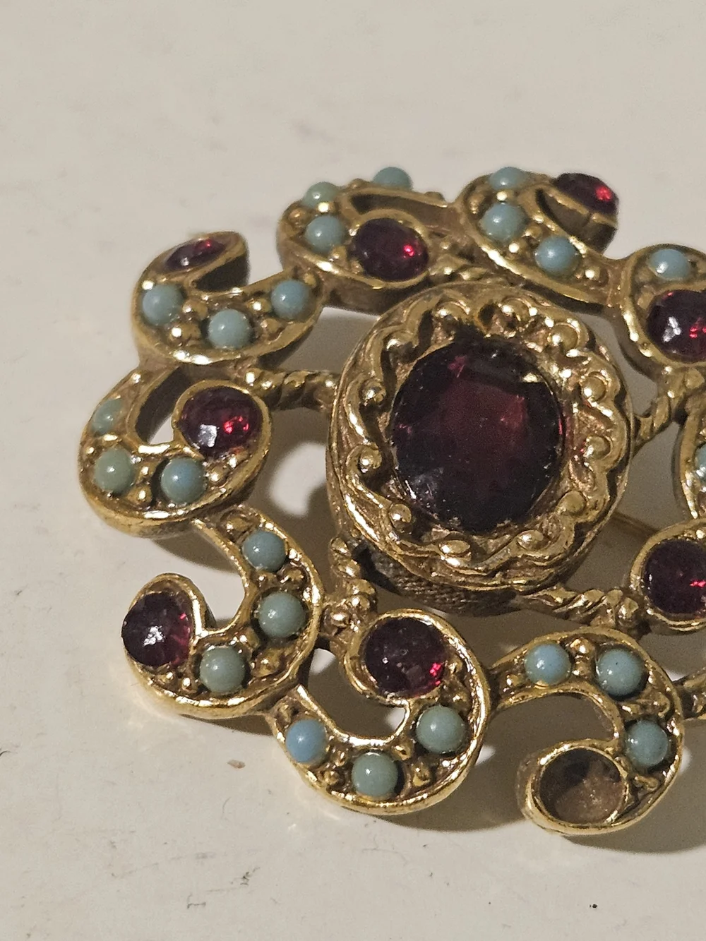 Gold-Tone Floral Brooch with Deep Red and Turquoise Accents